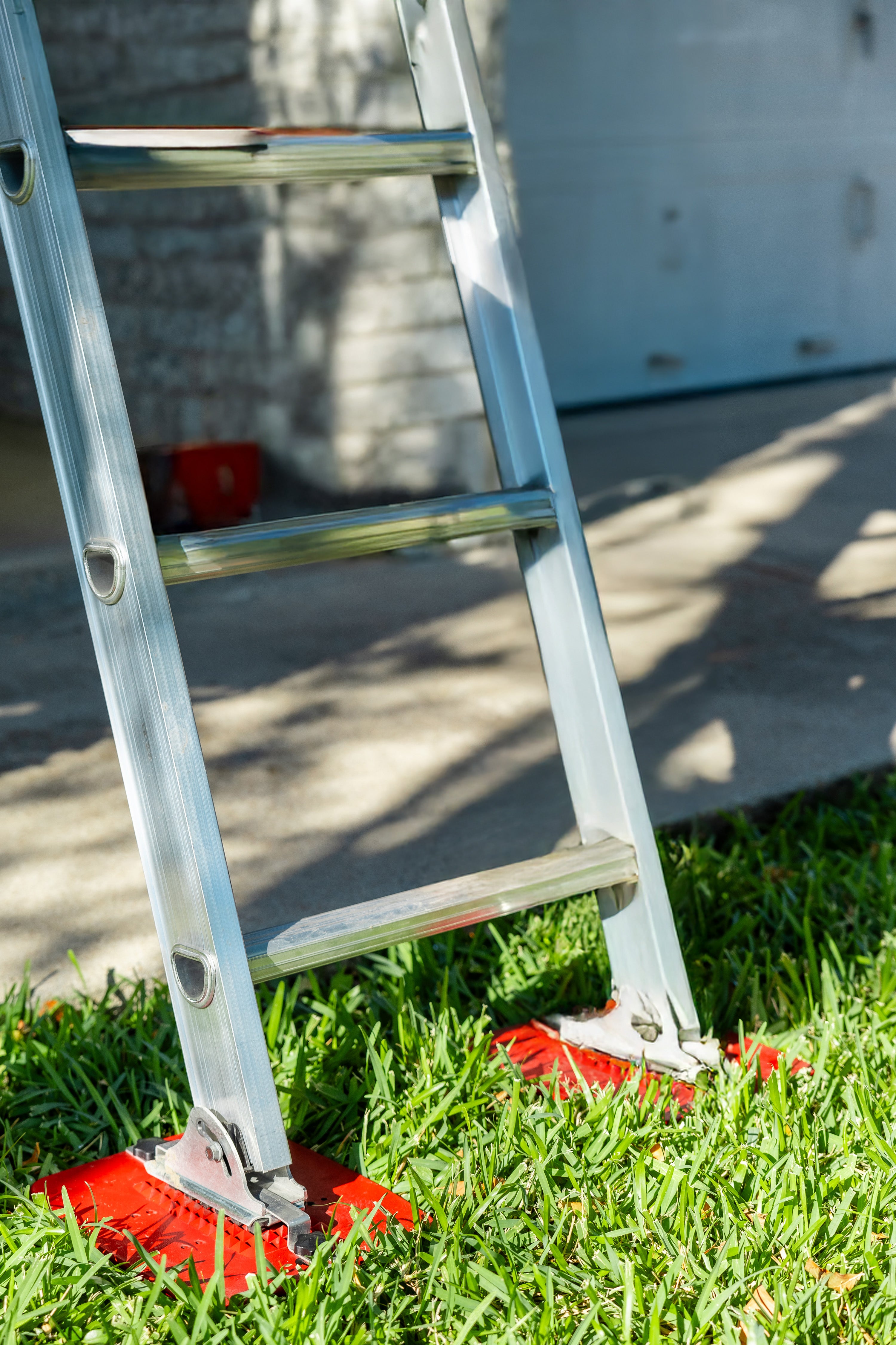 Extension Ladder Kit wide base preventing ladder from sinking on soft ground.
