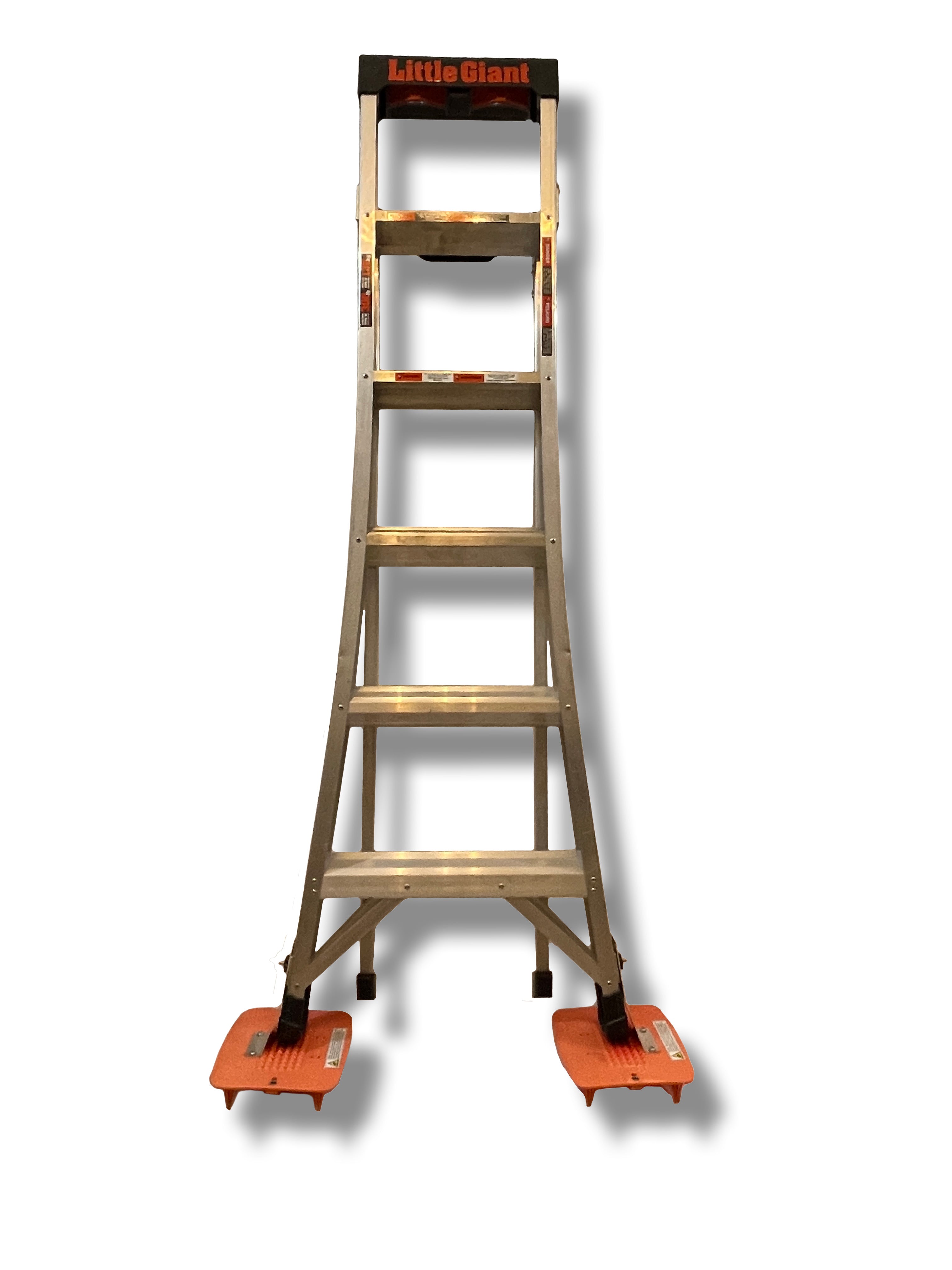 Angled Foot Kit for Specialty A-Frame Ladders stabilizing a ladder on uneven outdoor terrain like grass and gravel.