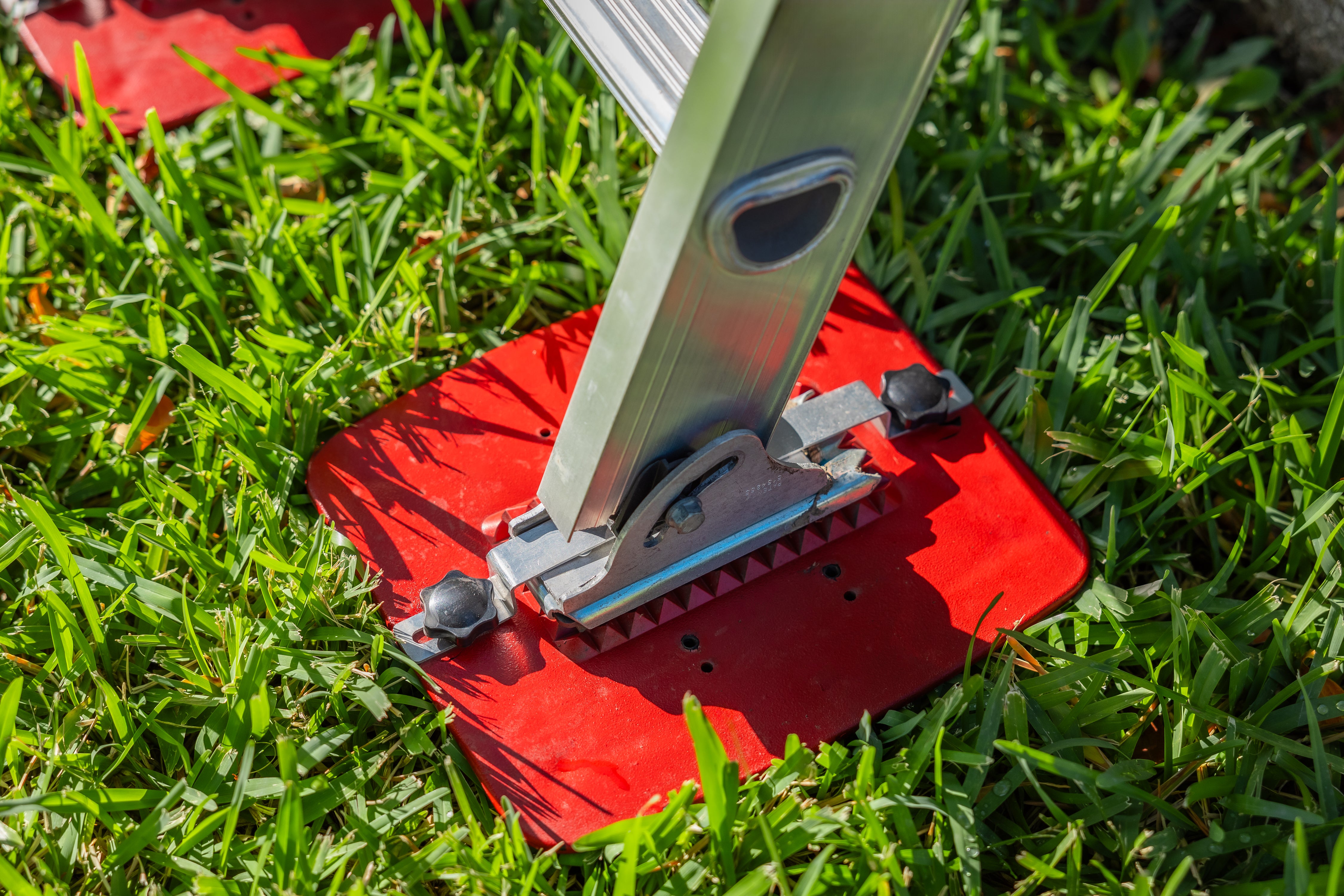 Extension Ladder Kit wide base preventing ladder from sinking on soft ground.